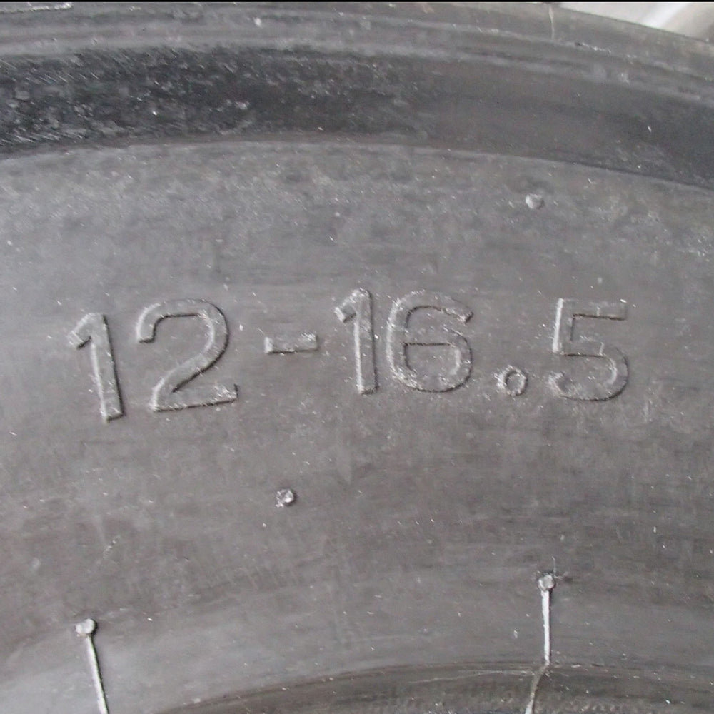 One New Heavy Duty 12-16.5 12-Ply Skid Steer Tire w/ Rim Guard Fits Bobcat